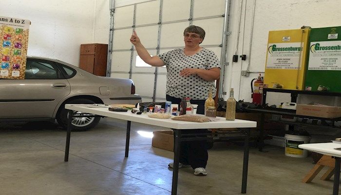 Lisa Lunz speaking to attendees about the value of membership in Farm Bureau