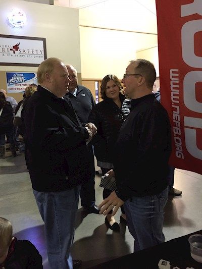 NFBF President Steve Nelson visits with Adam Peterson (Central RDM) at Hockey Game